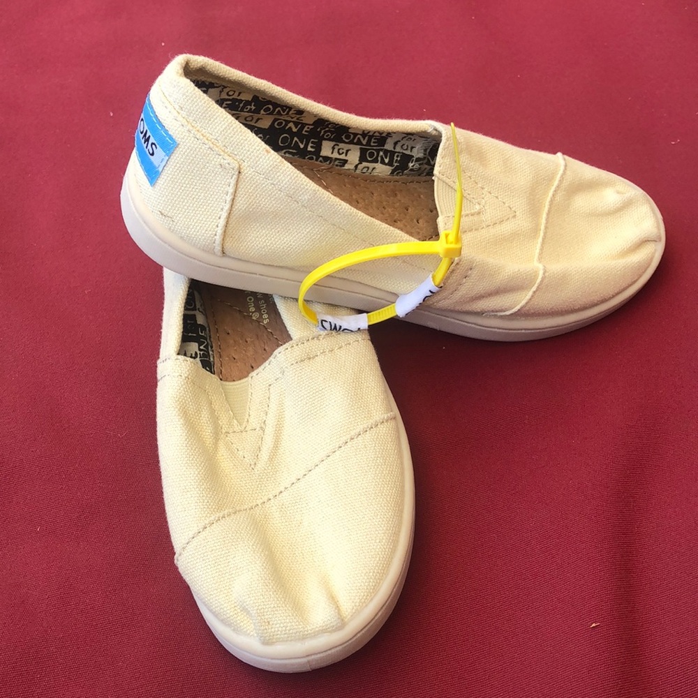 Toms Kids Slip-On Shoes in Pale Yellow with Blue Heel Tab